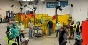 Workers in a factory lining up